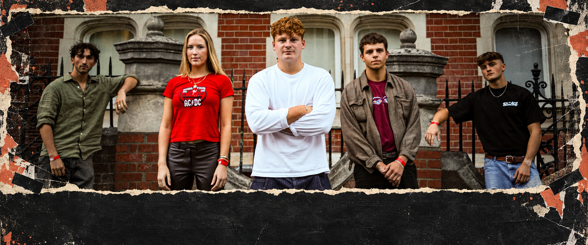 Cheap Street standing in a row in front of a red-brick building, framed by torn black paper