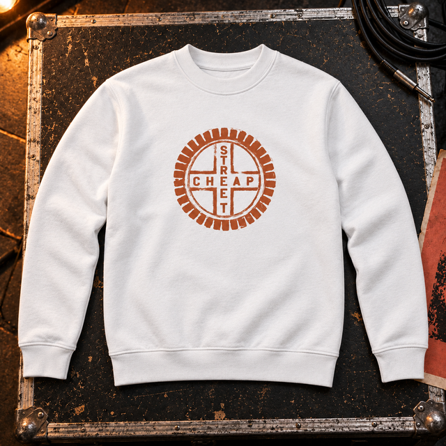 Cheap Street logo sweatshirt in white with the terracotta Cheap Street emblem on the chest, laid on a flight case