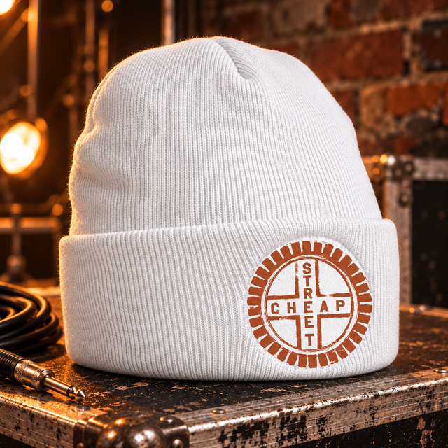 Cheap Street logo beanie in white with the terracotta Cheap Street emblem on the cuff patch, on a flight case