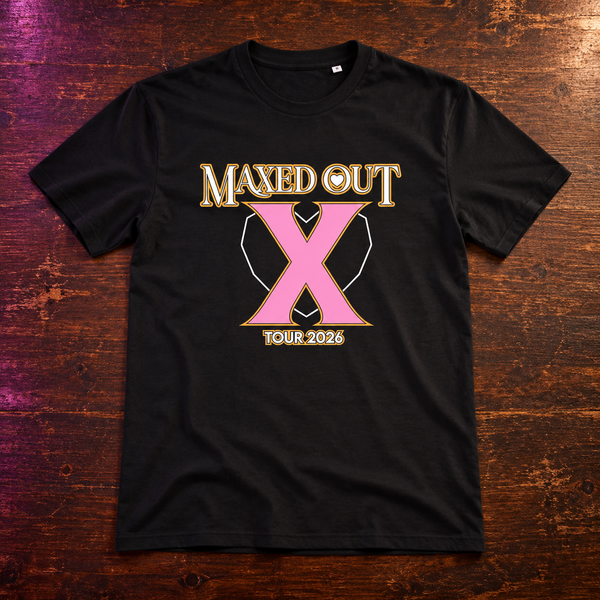 Black X Tour 2026 T-shirt laid on a wooden table