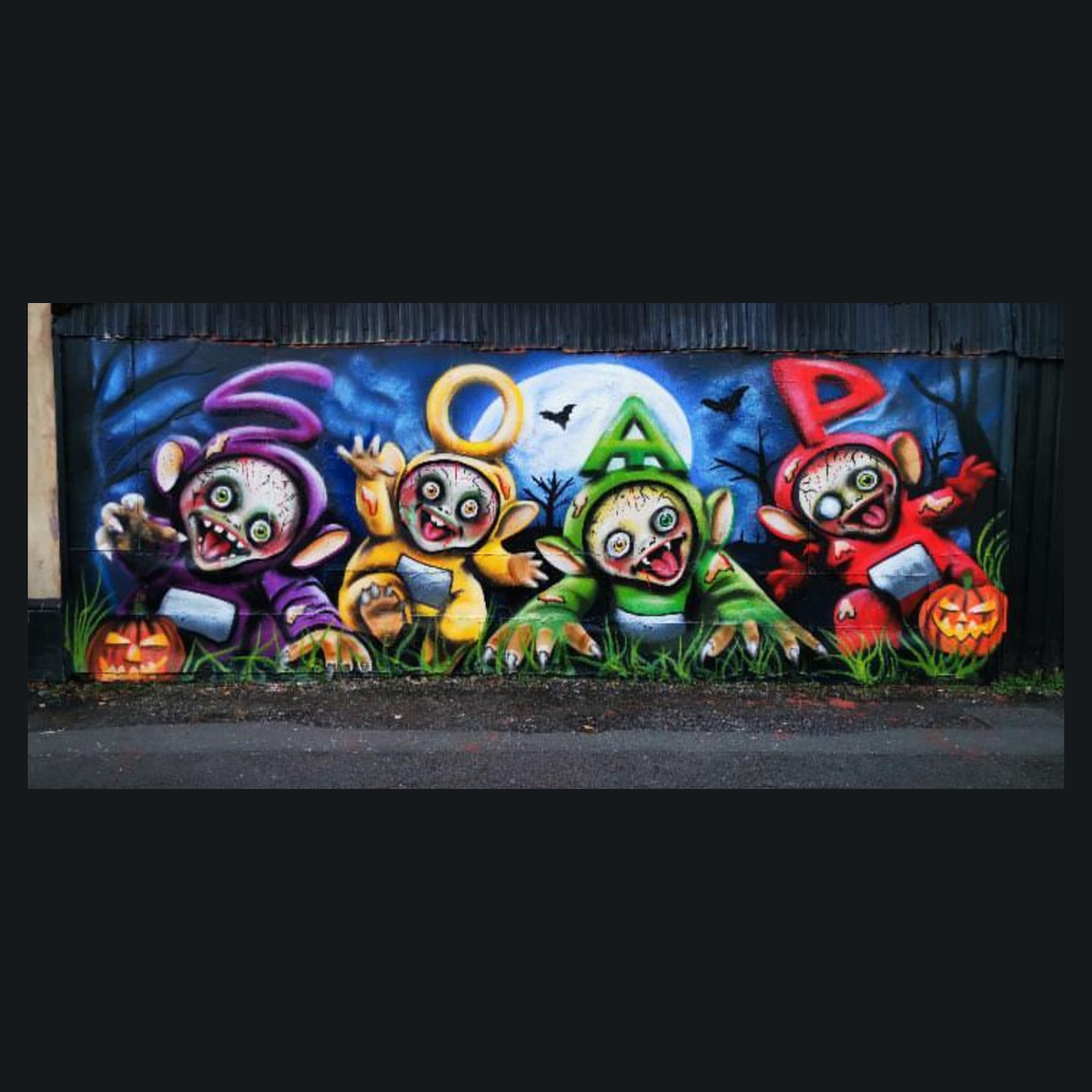 SOAP's complete Halloween mural framed by charcoal space, showing all four characters, the moon and both pumpkins